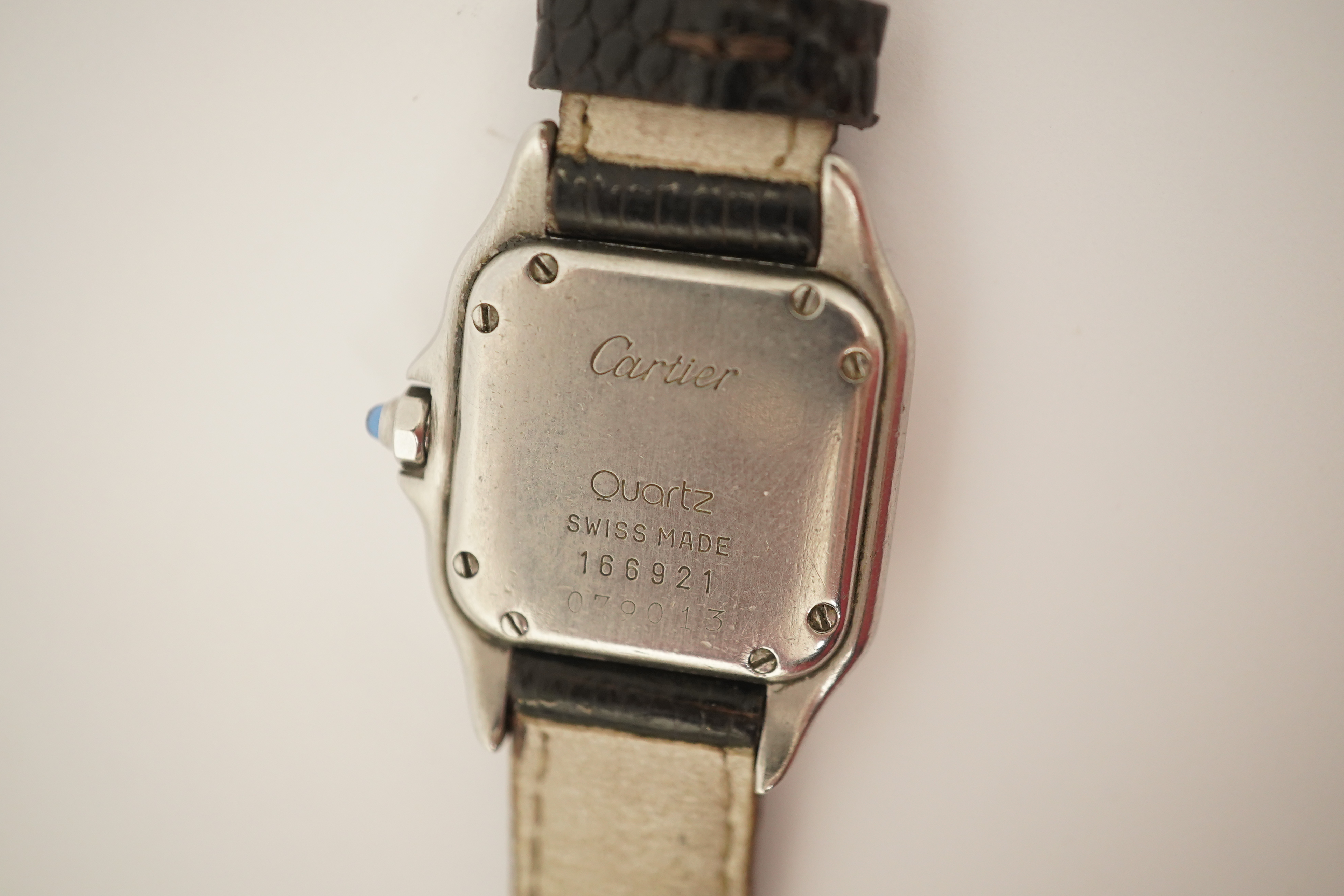 A lady's steel and gold Cartier Panthere quartz wrist watch, now on an associated leather strap, but with original Cartier steel and gold bracelet (lacking end bars)